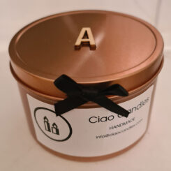 Candle with wooden initials on lid